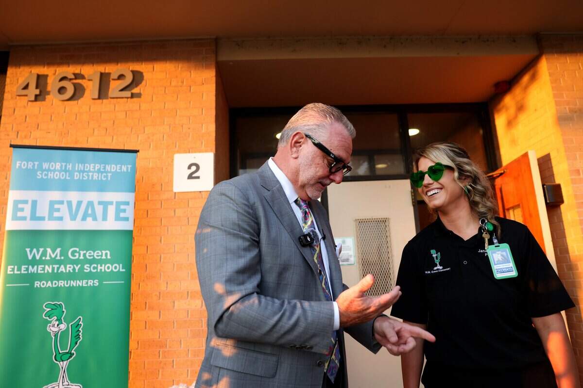 Fort Worth Independent School District Superintendent Peter Licata, left, talks to W.M. Green Elementary School Principal Janae Capshaw before the start of the first day of school on Monday, Aug. 10, 2026, in Fort Worth. W.M. Green Elementary is part of the new Elevate Network.
